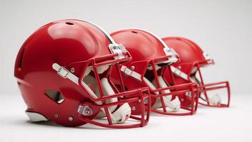 Mediumshot image featuring red American football helmets against a white backdrop photo