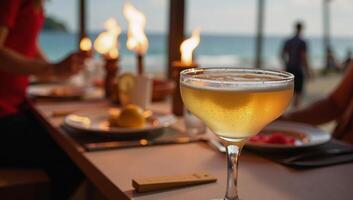 Tiki torchlit beachside party highlights a glowing margarita glass photo