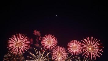 Red Fireworks illuminating the night sky photo