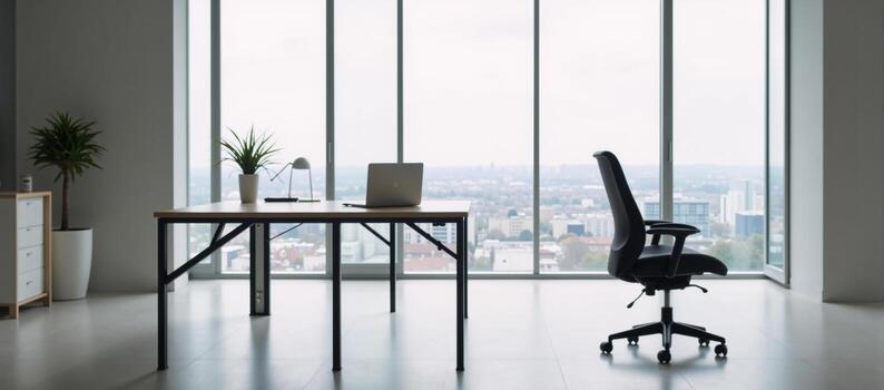 a modern office environment centered around a large window and desk setup photo