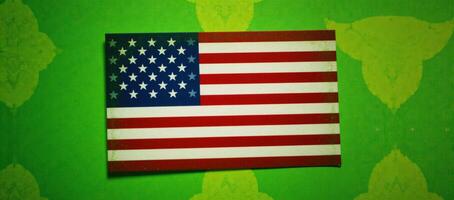 Tight shot of an American Flaginspired scene with soft focus on green and yellow background photo