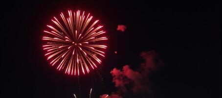 Red Fireworks illuminating the night sky photo