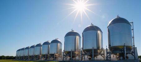 Blue spherical hydrogen tanks in a modern innovation power station showcasing BPVC technology and housing H2 molecules beneath the summer sky photo
