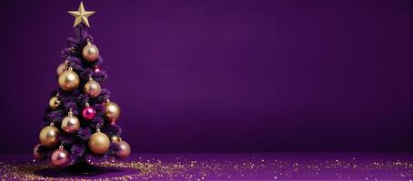 A Christmas tree decorated with gold ornaments adorns a purple backdrop complete with a shimmering gold star atop photo