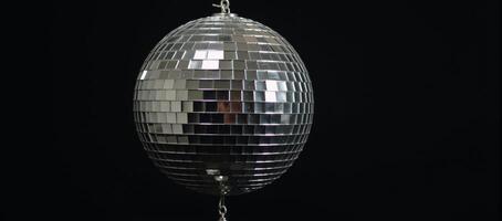 Disco ball isolated against minimalistic backdrop photo