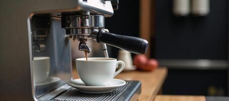 A retrostyle espresso machine featuring a coffee cup photo