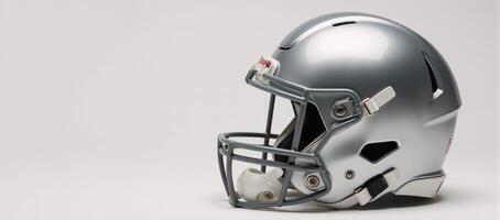 Sleek metallic football helmet on a clean white backdrop photo