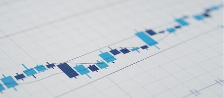 Closeup image of a blue stock market trading chart with detailed candlestick graphs photo