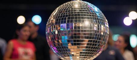 Rainbowhued reflections on a sparkling disco mirror ball photo