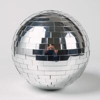 Isolated silver disco mirror ball against blank background photo