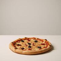 Isolated top view of a baked pizza against plain backdrop photo