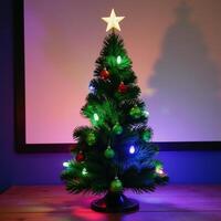 Green Christmas Tree with Bright Ornaments Against Glowing Background photo