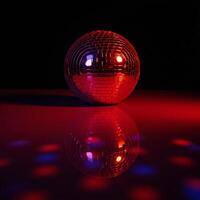 A shimmering red disco ball reflects light against an empty backdrop symbolizing a festive and lively atmosphere photo