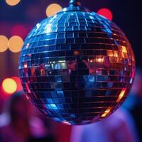 A sparkling disco ball at a night party against a backdrop of vibrant dance floor and glowing cityscape photo