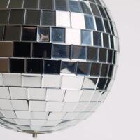 Isolated disco ball against plain background photo