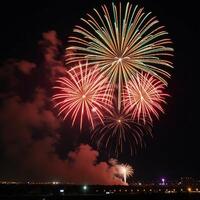A lively display of colorful fireworks lights up the holiday night sky setting a festive mood photo