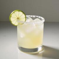 Lemonlime cocktail garnished with a twist of lime photo
