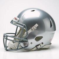 Highangle view Shiny silver football helmet with facemask and white pads photo
