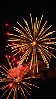 Isolated golden fireworks against a black backdrop photo