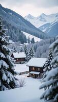 A snowcovered Christmas village with distant mountain views under a light dusting of frost on the trees photo