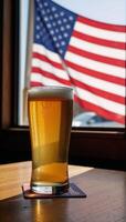 Patriotic bar scene featuring a glass of beer and an American flag photo