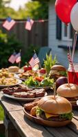 A patriotic Fourth of July backyard barbecue featuring red white and blue decorations photo
