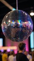 Rainbowhued reflections on a sparkling disco mirror ball photo