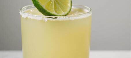 Classic Margarita with Lime Wedge Isolated against Background photo
