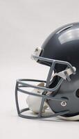 Sleek metallic football helmet on a clean white backdrop photo
