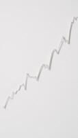 Minimalist smooth upward trend in stock prices displayed on a clean white chart photo