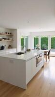 Modern kitchen showcasing an island countertop and patio doors photo