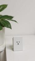Closeup perspective of an empty interior bedroom side table with visible electrical outlet mockup photo