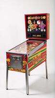 Vintage pinball machine with vibrant colors set against a clean white backdrop photo
