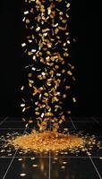 Gold confetti swirls over a black dance floor photo