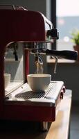 A retrostyle espresso machine featuring a coffee cup photo