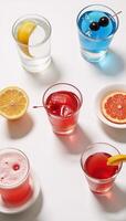 Topdown shot displaying colorful cocktails against a clean white backdrop photo