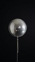 Disco ball isolated against minimalistic backdrop photo