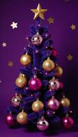 A Christmas tree decorated with gold ornaments adorns a purple backdrop complete with a shimmering gold star atop photo