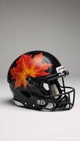 Football helmet sporting autumnal maple leaf design celebrates sports heritage and seasonal transition photo