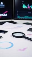 Data analysis with focus on search engine optimization using magnifiers charts graphs universitystyle neon screens and stock images photo