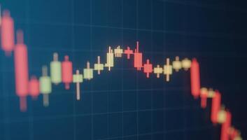 Glowing candlesticks depicted against a hazy blue backdrop as a symbol of trade finance and stocks in a 3D rendering style photo