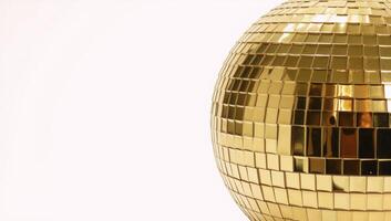 Gold Disco Ball against White Backdrop photo