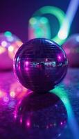 A glittering purple disco ball surrounded by colorful disco lights photo