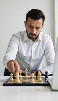 Businessman making strategic moves with chess pieces signifying business planning and decisionmaking photo