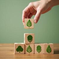 Handstacking wooden blocks with ecofriendly green symbols signifies commitment to sustainable living in surreal softgreen illustration photo