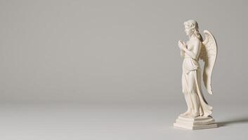 A detailed angel statue stands tranquilly on a simple backdrop for a peaceful ambiance photo