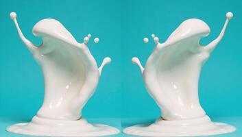 Milk splash reflected on bluegreen background mirrored photo