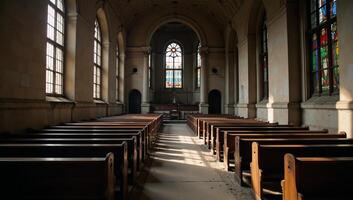 A decrepit church adorned by stainedglass windows and empty pews photo