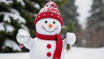Cheerful snowman with red hat and scarf holding festive ornament and greenery photo