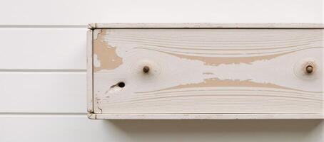 Rustic vintage scene featuring white shiplap backdrop with distressed wooden elements photo